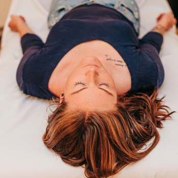 A patient resting on the table waiting for cosmetic acupuncture at Seneca Falls Acupuncture.