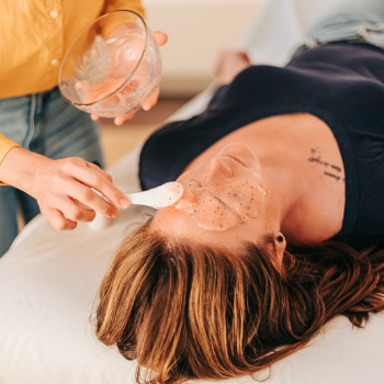 Patient relaxing while Goji Antioxidant Hydrojelly Mask is applied at the end of the Acupuncture Glow Facial at Seneca Falls Acupuncture.